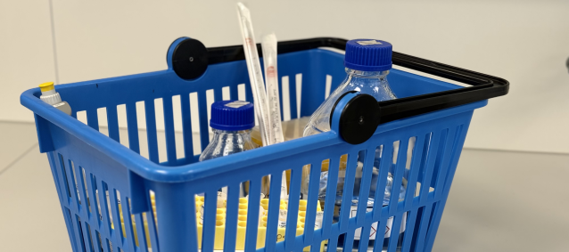 Shopping basket with lab supplies on a bench